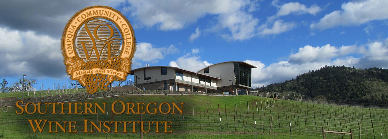 A modern building on a hillside with vineyards, under a blue sky with clouds, featuring the Southern Oregon Wine Institute logo.